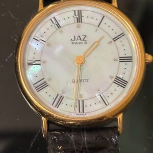 Gold and Black Men's Watch with peral face